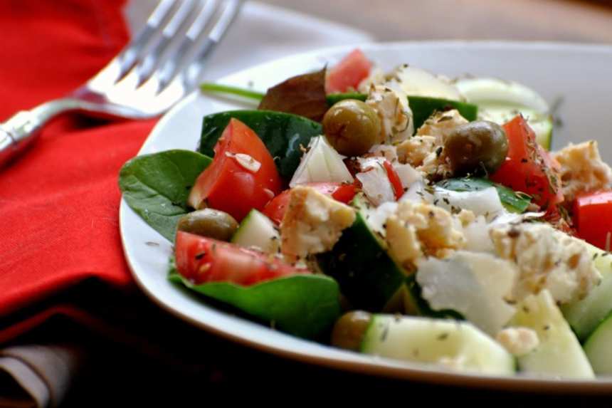 Greek salad with feta, olives, onion, and peppers